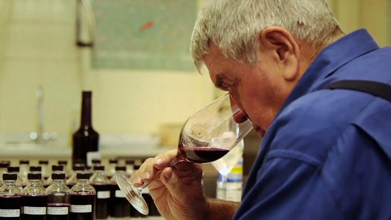 man sniffing wine