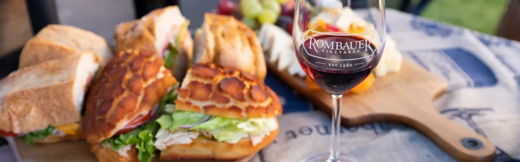 Glass of Rombauer wine and sandwiches