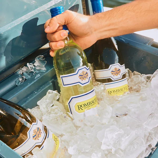 Rombauer Sauvignon Blanc being pulled out of ice chest with Chardonnay