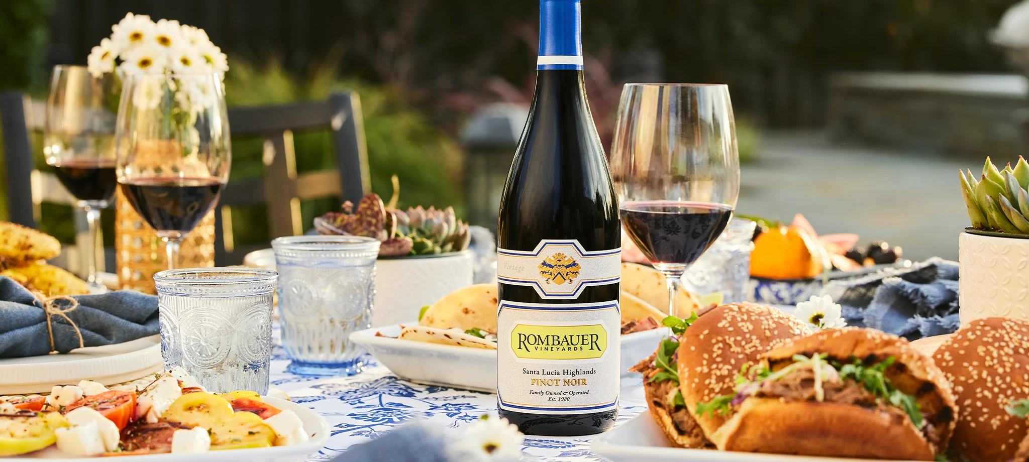 Rombauer Pinot Noir on a n outdoor dining table