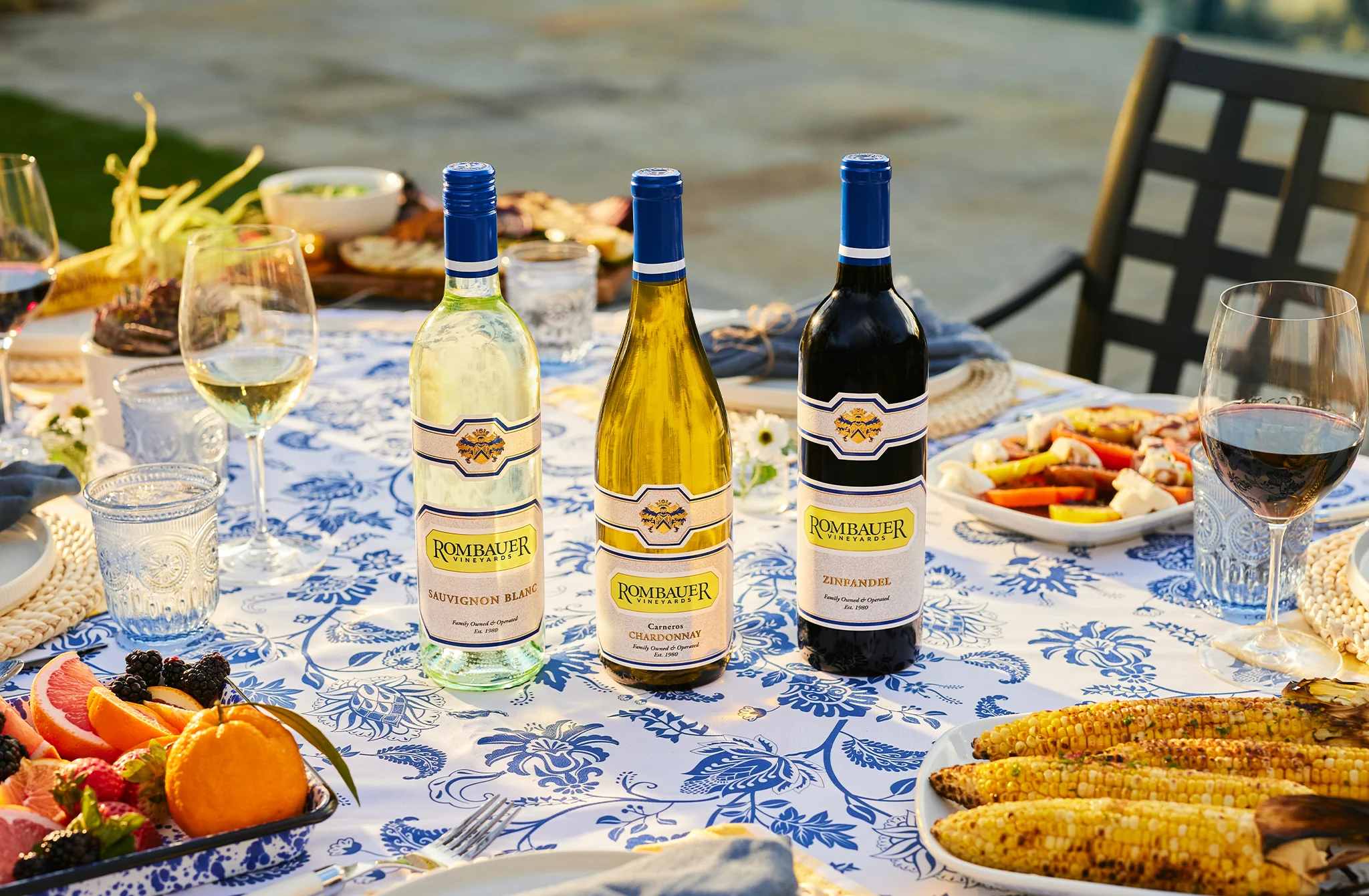 Rombauer Sauvignon Blanc, Rombauer Chardonnay, and Rombauer Zinfandel on outdoor dining table