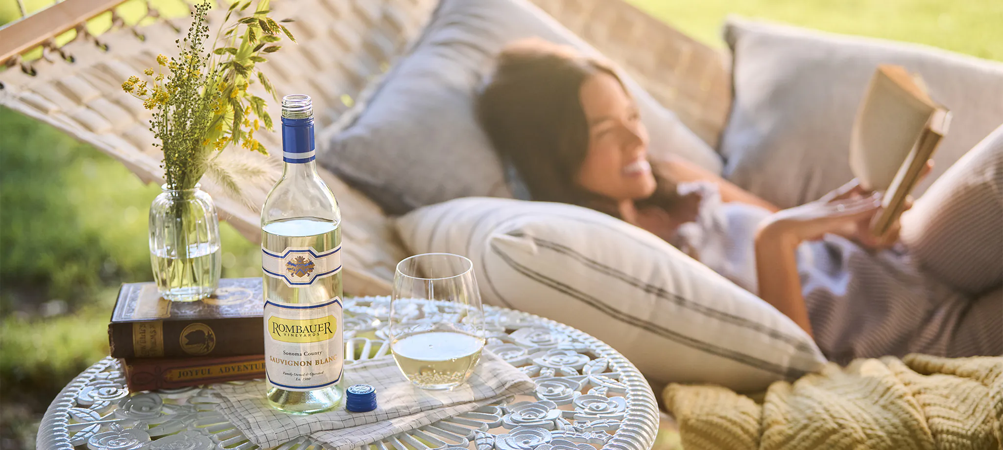 REading in a hammock with Sauvignon Blanc