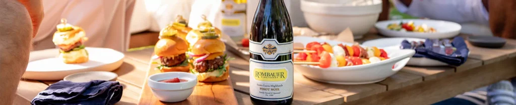 Rombauer Pinot Noir with plated dishes