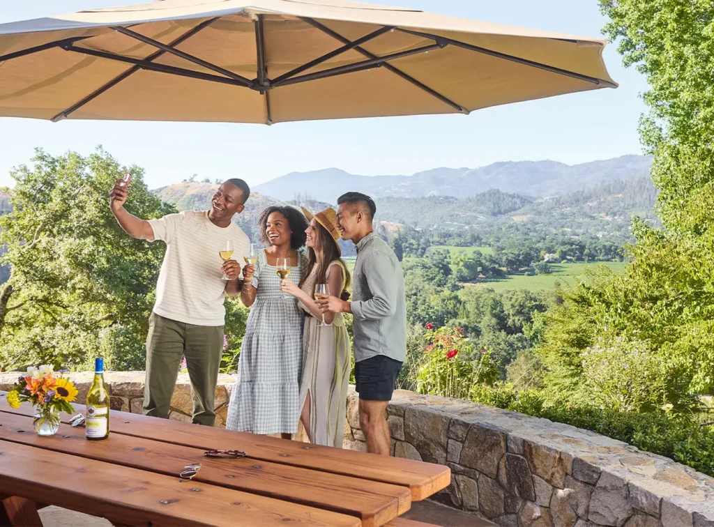 People taking a selfie on the patio at the Napa Valkey Tasting Room