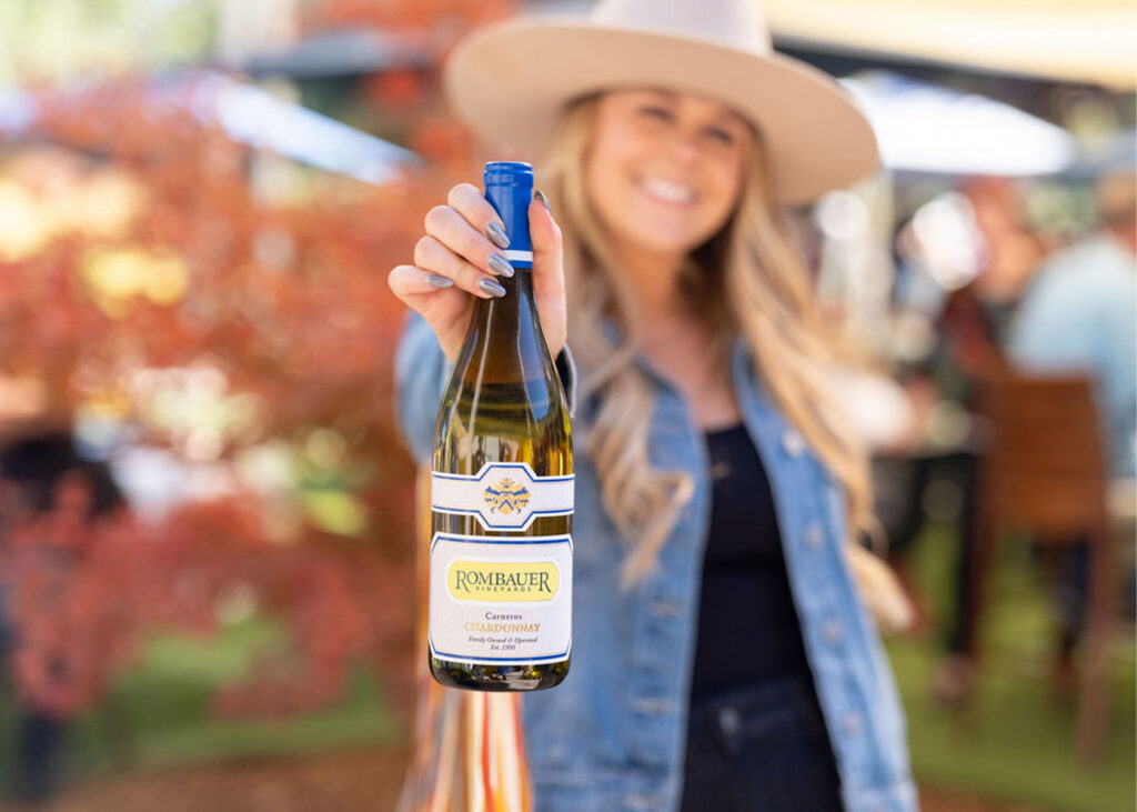 Woman holding bottle of Rombauer Chardonnay